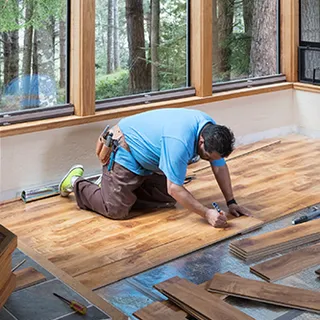 Installer laying a new floor
