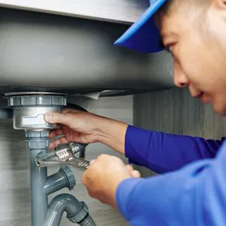 Plumber repairing pipes