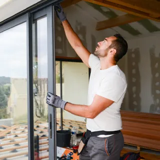 Installer fitting a new window